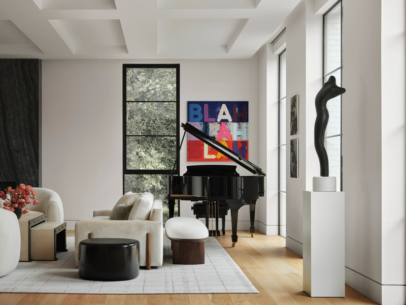 Press kit | 6087-05 - Press release | Palm Residence: A Harmonious Fusion of Hospitality and Home - Daniel Joseph Chenin - Residential Interior Design - Art filled entertaining lounge on the main level of the home with custom Egan sofa by Bright Chair Company, Corbu bench by DeMuro Das, Holly Hunt River Rock table, and Jean De  Merry Axel coffee table with benches. Painting by Mel Bochner. - Photo credit: Douglas Friedman