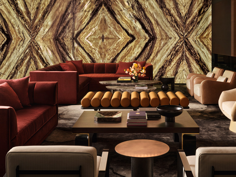 Press kit | 6087-05 - Press release | Palm Residence: A Harmonious Fusion of Hospitality and Home - Daniel Joseph Chenin - Residential Interior Design - A custom coffee table with an elegant metal base, designed by Daniel Joseph Chenin, is  paired with custom Allan Knight sectional sofas in wine toned velvet, an antique brass  topped Konekt side table, Kong club chairs by Francesc Rifé, and Five to Nine Daybed by Tacchini.  - Photo credit: Douglas Friedman