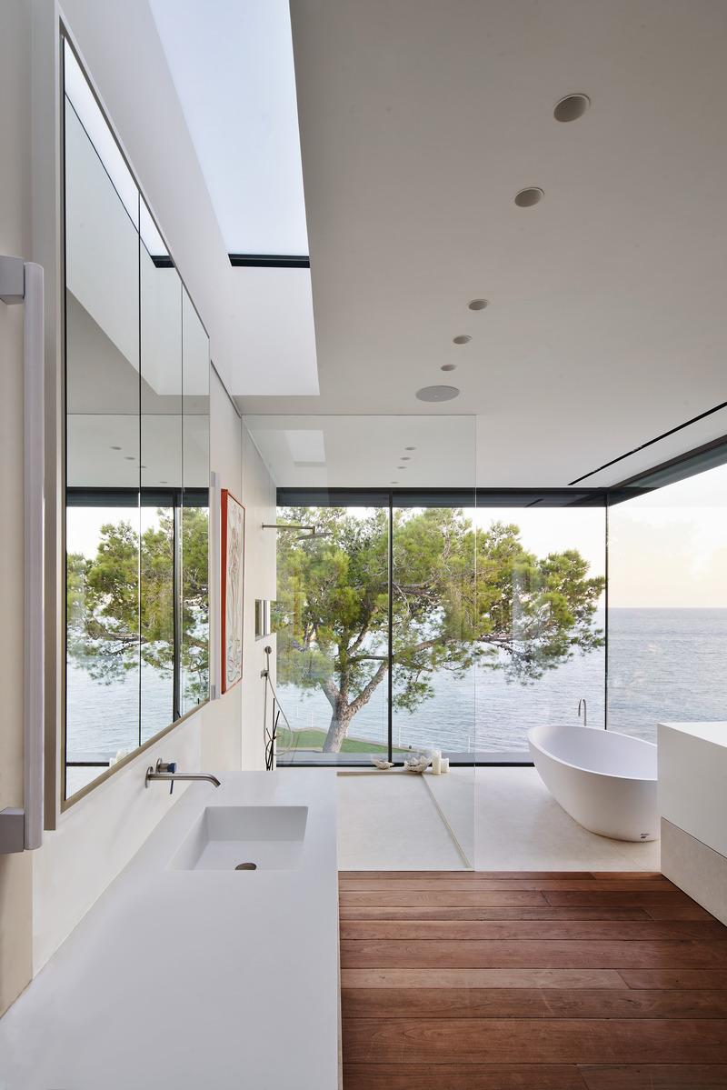 Press kit | 2757-44 - Press release | SWATT + PARTNERS' Eloquently Modern Architecture Lives Well in Singular Settings - SWATT + PARTNERS - Residential Architecture -  Casa Athena: Breathtaking views of the ocean and nearby island can be enjoyed from the master bedroom suite and bath on the upper level, as well as from the kitchen, dining and living spaces on the lower level.  - Photo credit: Jose Hevia