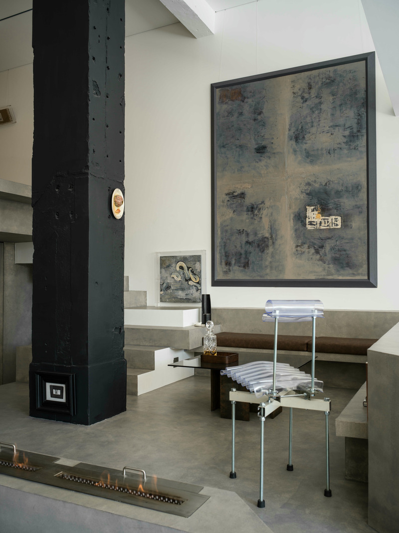 Press kit | 5577-03 - Press release | 743 ART Lab - NONG STUDIO - Commercial Interior Design - The coffee table on the mezzanine platform, made from discarded I-beams and tea-colored glass, combines in a cross formation, showcasing a sense of strength while subtly expressing symbols and the spirituality of the material itself. - Photo credit: Heinong