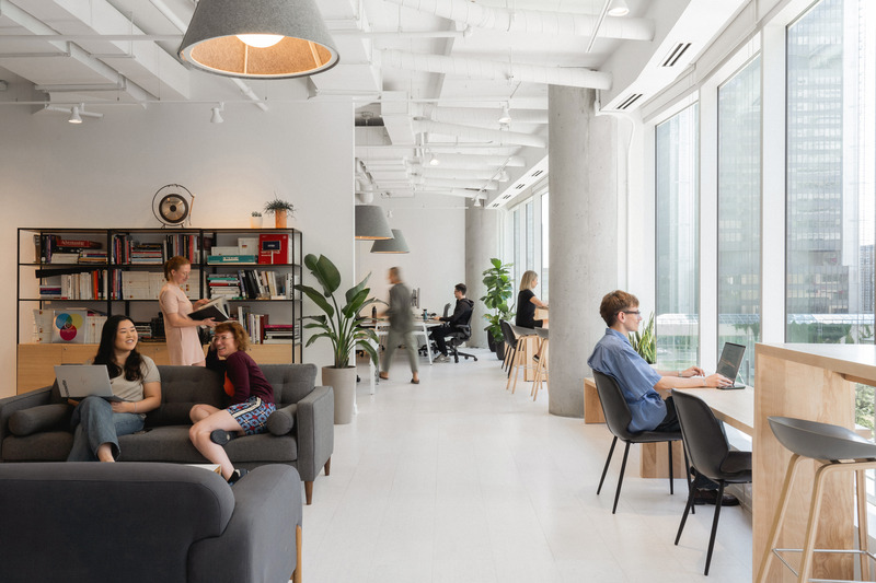Press kit | 2626-04 - Press release | Plus Company Campus & Cossette Offices - LAAB architecture - Commercial Interior Design - View of typical workplace pod featuring view towards Suqare-Victoria - Photo credit: Raphael Thibodeau