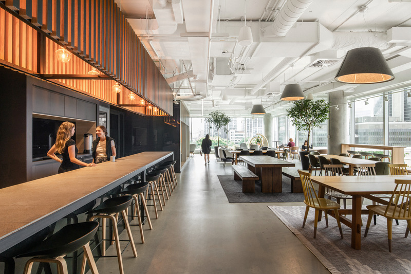 Press kit | 2626-04 - Press release | Plus Company Campus & Cossette Offices - LAAB architecture - Commercial Interior Design - View towards Bistro-Park and lounge bar - Photo credit:  Raphael Thibodeau 